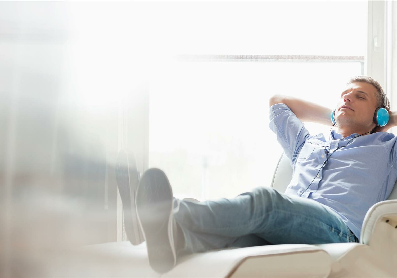 Man relaxing listening to music